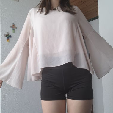 Light pink blouse with trumpet sleeves