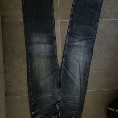 Blue denim jeans with raw hems