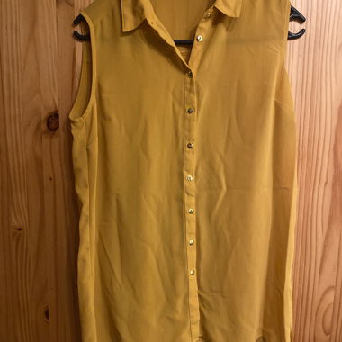 Yellow sleeveless blouse
