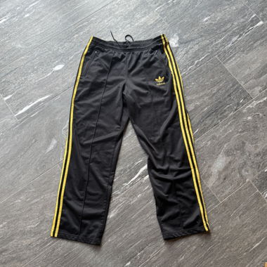 Pantaloni da training Adidas nero-giallo
