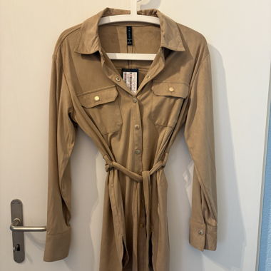 Beige women's blouse with tie belt