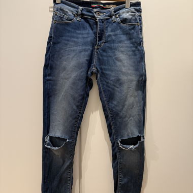 Blue skinny jeans with ripped knees