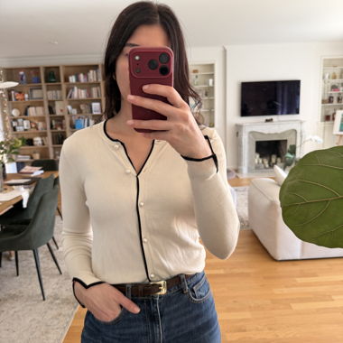 Beige cardigan with black trim