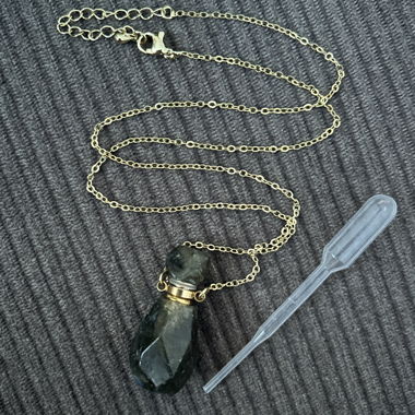 Perfume necklace of iridescent greenish gemstone