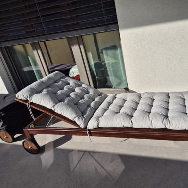 un loungers (2) with cushions and outdoor cover