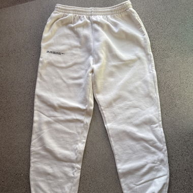 Cream track pants by Pangaia