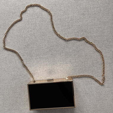 Starre Clutch-Tasche Schwarz und Gold
