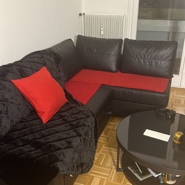 Black leather corner sofa