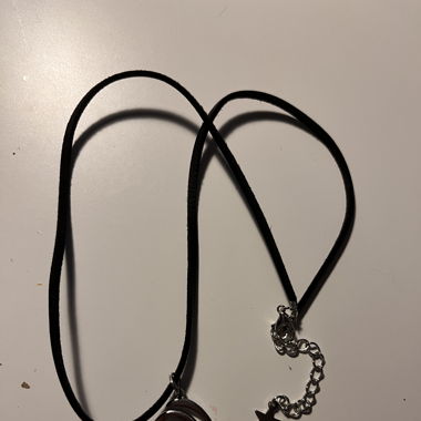Black leather necklace with spiral charm