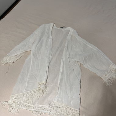 Gilet à franges blanc pour la plage