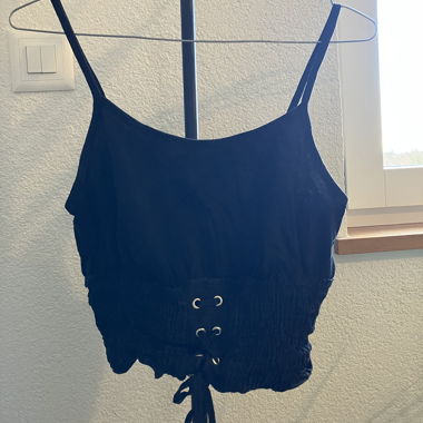 Black strappy top with lace-up detail