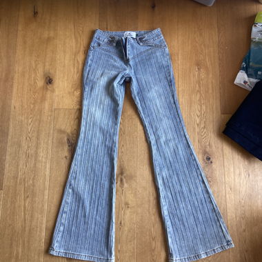 Light blue striped flared jeans