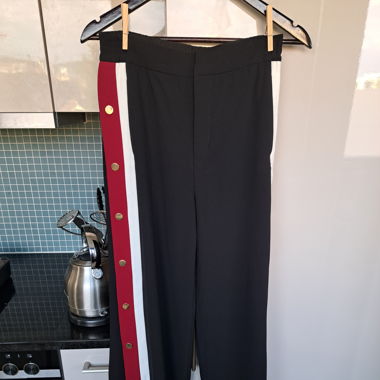 Pants with strips on the sides