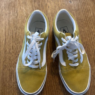 Yellow and white Vans with laces