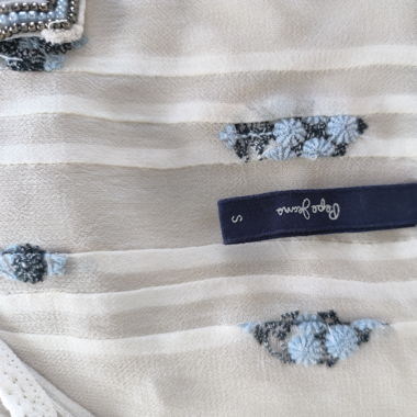 white blouse with blue pattern