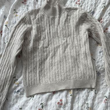Beige knit turtleneck sweater