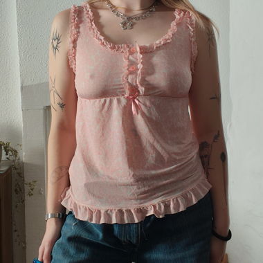 Pink ruffled sleeveless top