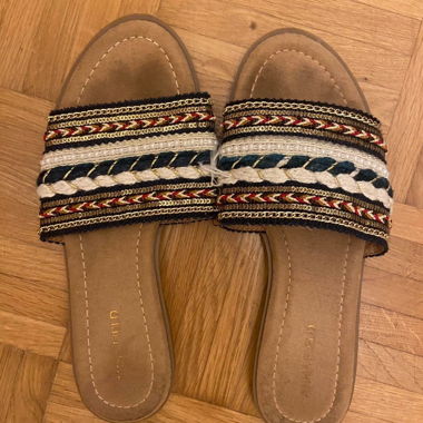 multi-colored sandal flip flops with a boho touch