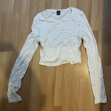 Maglia bianca a maniche lunghe