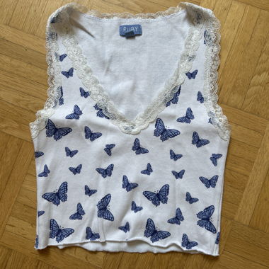 Top farfalla con pizzo