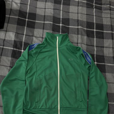 Veste Lacoste Verte avec bandes bleues/blanches