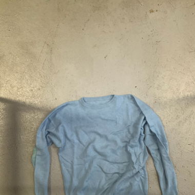light blue sweater with patches
