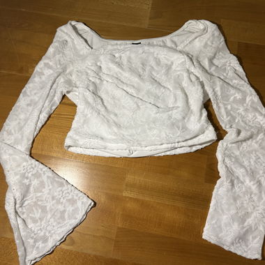 Top bianco a maniche lunghe