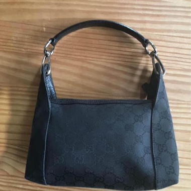 Gucci Pochette Schwarz aus GG Canvas