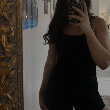 Black one-piece with suspenders
