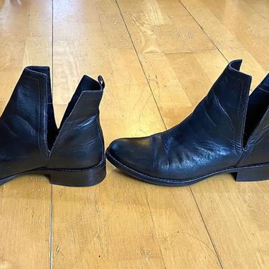 Black leather boots with side cut-out