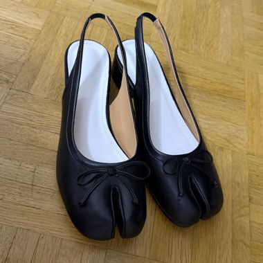 Schwarze Tabis-Pumps