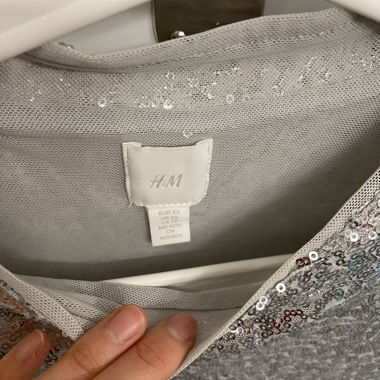 Top corto con paillettes H&M