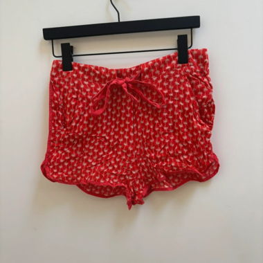 Short rosso con stampa palme