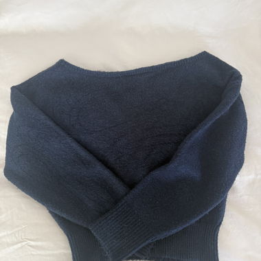 Subdued off-shoulder knit sweater