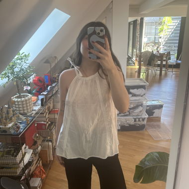 Top blanc à encolure cœur sans manches M