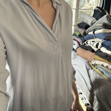 Light blouse with open collar light blue