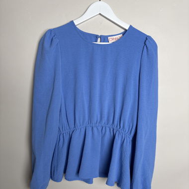 Blusa peplum blu a maniche lunghe