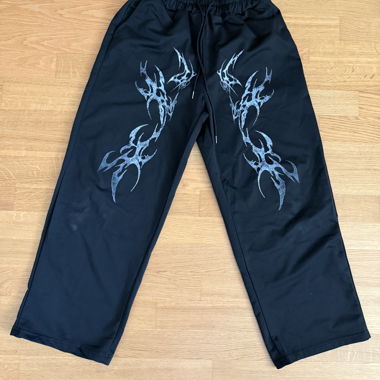 Pantalon avec cordon de taille et imprimé vinyle