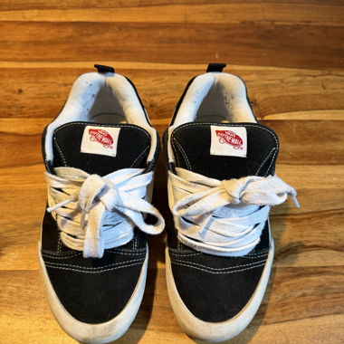 Black and white Vans sneakers
