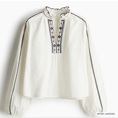 Blusa con collo a volant