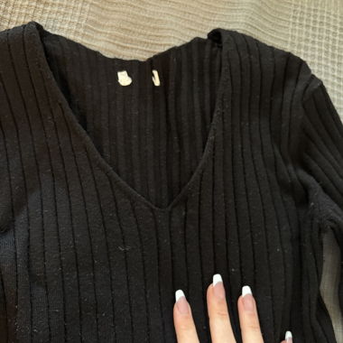 Black ribbed V-neck sweater