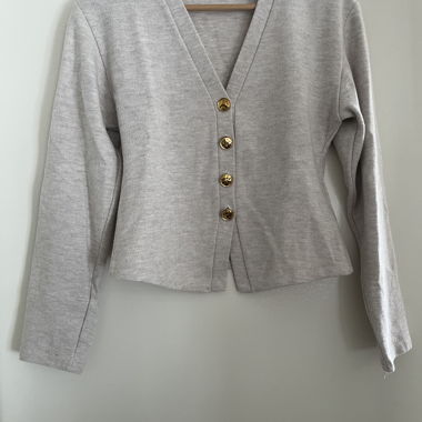 Soft cardigan with gold buttons and trousers