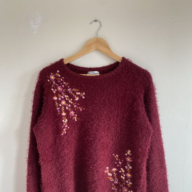 Maroon sweater with floral design