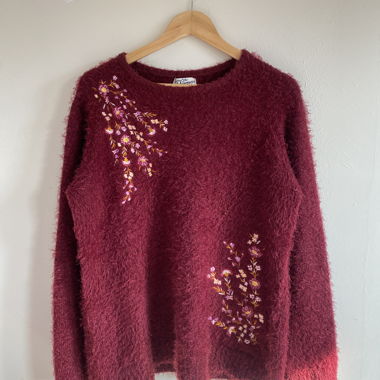 Maroon sweater with floral design
