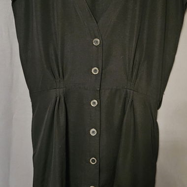 Blouse noire à patte de boutonnage