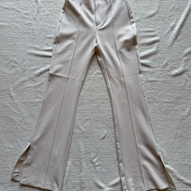 Pantaloni beige a zampa in tessuto
