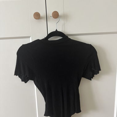 black body with ruffles