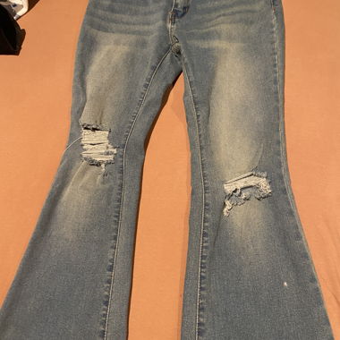 Flared trousers with holes