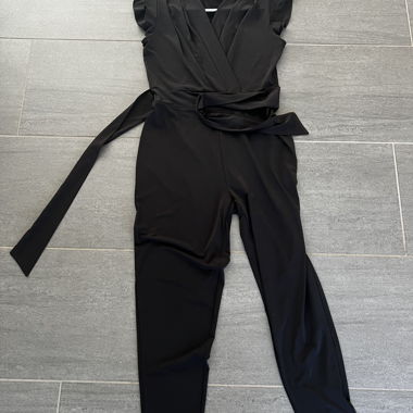 Elegant black one-piece by the brand zebra in size S.