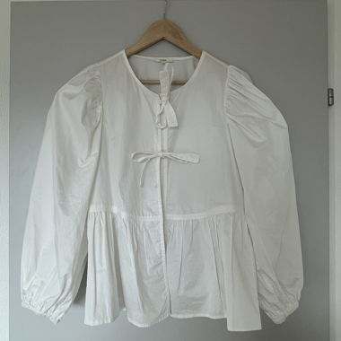 White blouse with bows